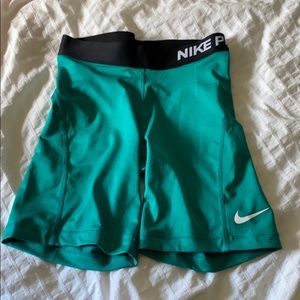 Nike Teal Athletic Shorts with Black Waistband and White Swoosh